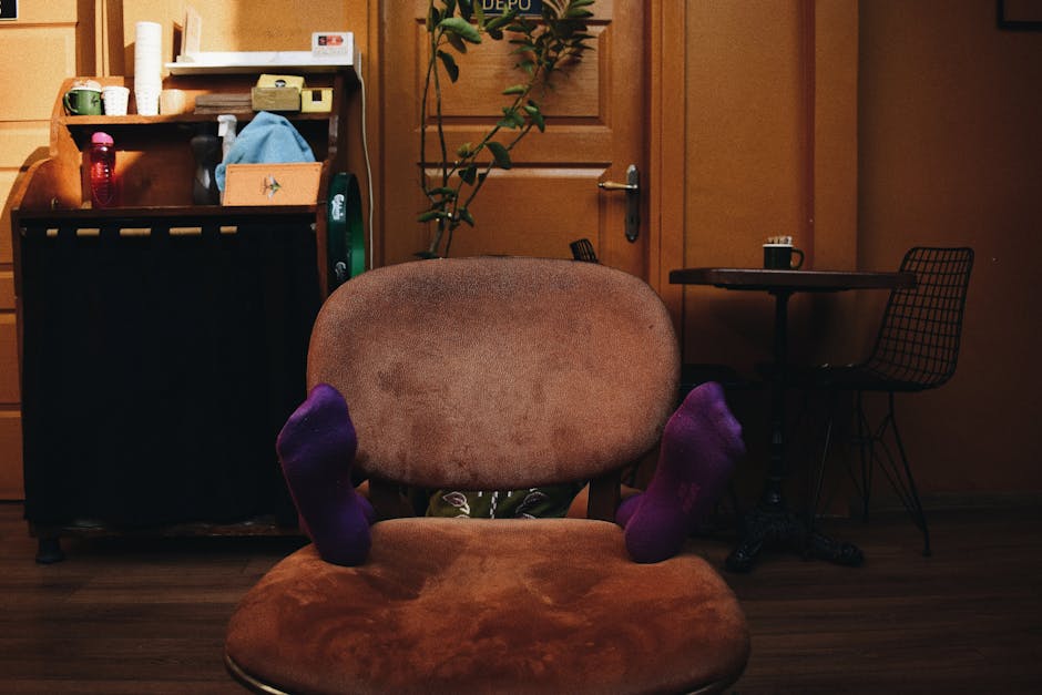 An inviting room with a comfortable chair, table, and playful socks for a cozy vibe.